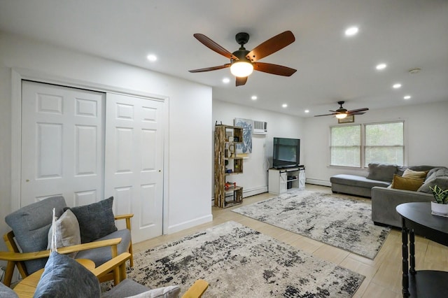 27 The Plains Rd, Levittown, NY 11756 - living area with ceiling fan, recessed lighting, a baseboard heating unit, and light wood-style flooring