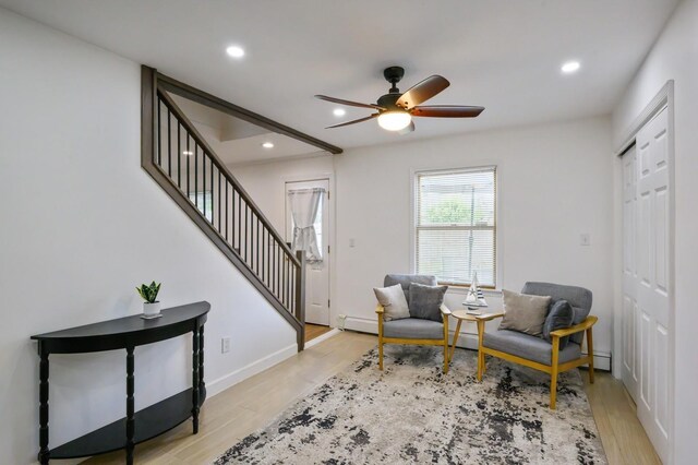 27 The Plains Rd, Levittown, NY 11756 - sitting room featuring stairway, a ceiling fan, light wood-style floors, recessed lighting, and baseboard heating