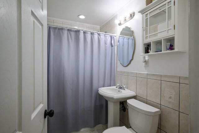 27 The Plains Rd, Levittown, NY 11756 - bathroom with a shower with shower curtain, tile walls, and crown molding