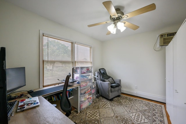 27 The Plains Rd, Levittown, NY 11756 - office featuring a baseboard heating unit, ceiling fan, and wood finished floors