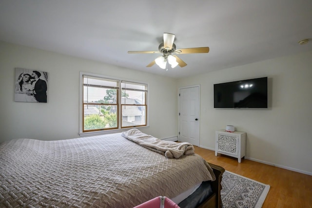 27 The Plains Rd, Levittown, NY 11756 - bedroom with wood finished floors and a ceiling fan