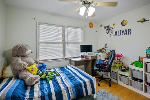 27 The Plains Rd, Levittown, NY 11756 - bedroom with wood finished floors and ceiling fan