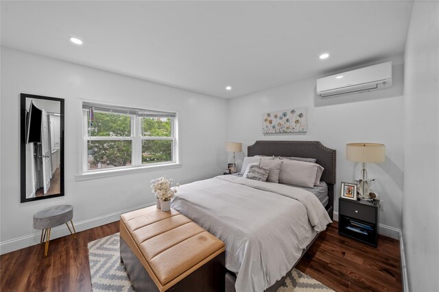 3234 204th St, Bayside, NY 11361 - bedroom with an AC wall unit, wood finished floors, and recessed lighting