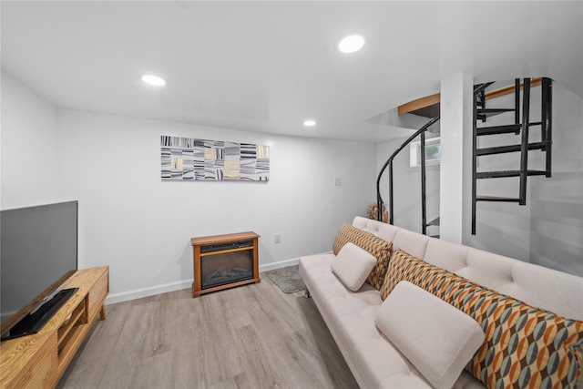 3234 204th St, Bayside, NY 11361 - living room with wood finished floors, recessed lighting, and a glass covered fireplace