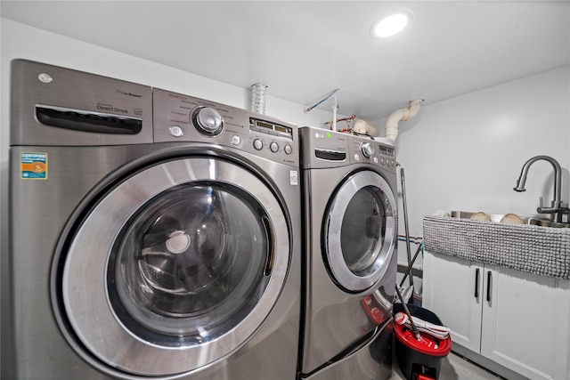 3234 204th St, Bayside, NY 11361 - laundry room with cabinet space and washer and clothes dryer