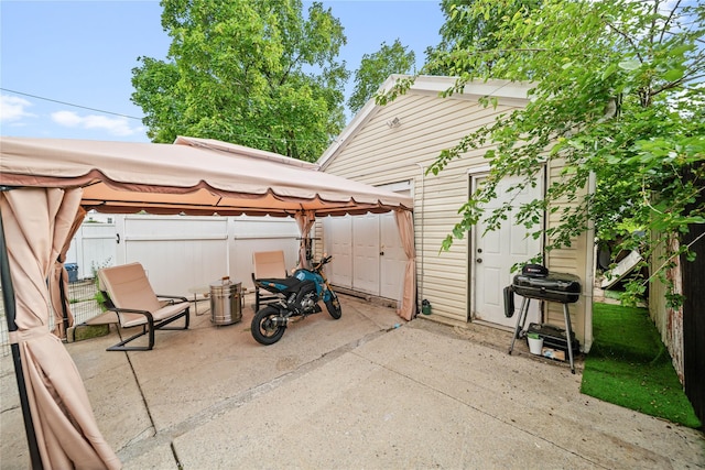 3234 204th St, Bayside, NY 11361 - fenced backyard featuring a gazebo, a patio, and an outbuilding