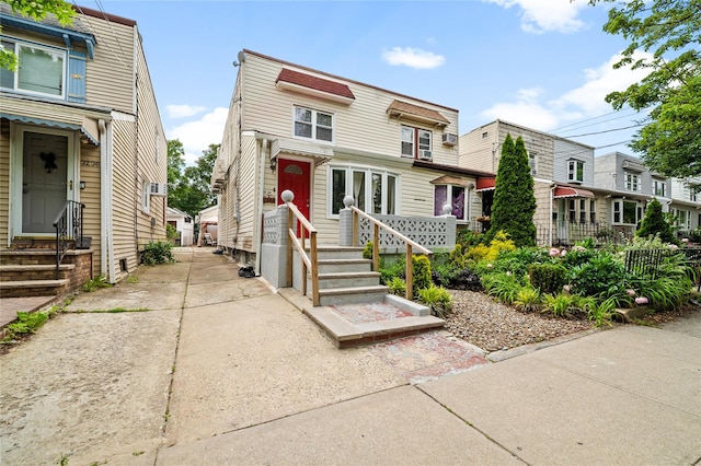 3234 204th St, Bayside, NY 11361 - townhome / multi-family property with a residential view and entry steps