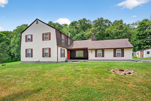 4 Debbie Ct, Chester, NY 10918 - view of front facade with a front yard, a chimney, and a fire pit