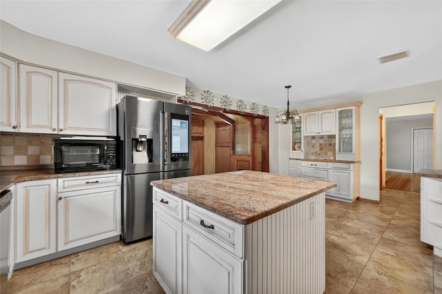 4 Debbie Ct, Chester, NY 10918 - kitchen with stainless steel refrigerator with ice dispenser, decorative backsplash, a chandelier, a kitchen island, and decorative light fixtures