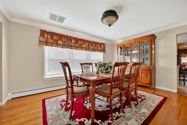 4 Debbie Ct, Chester, NY 10918 - dining space with baseboard heating, light wood finished floors, and crown molding