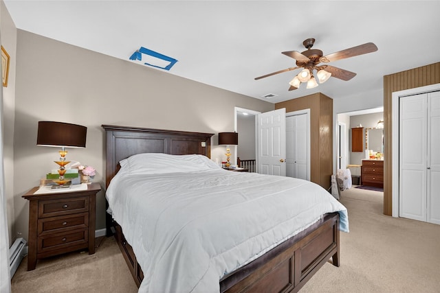 4 Debbie Ct, Chester, NY 10918 - bedroom featuring light colored carpet, multiple closets, a baseboard heating unit, ceiling fan, and ensuite bathroom