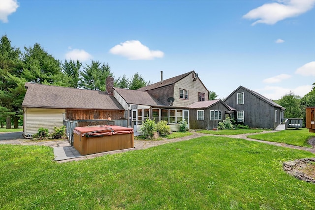 4 Debbie Ct, Chester, NY 10918 - rear view of house with a hot tub, a sunroom, a lawn, and a chimney