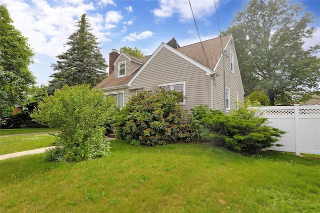 602 Leonard Ave, Uniondale, NY 11553 - view of side of property featuring a chimney and roof with shingles