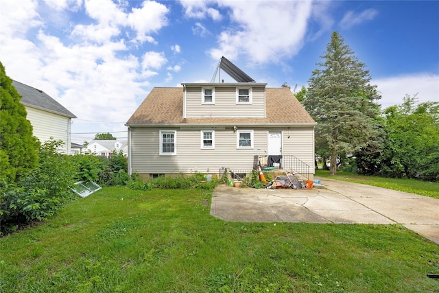 602 Leonard Ave, Uniondale, NY 11553 - rear view of house with a yard and roof with shingles