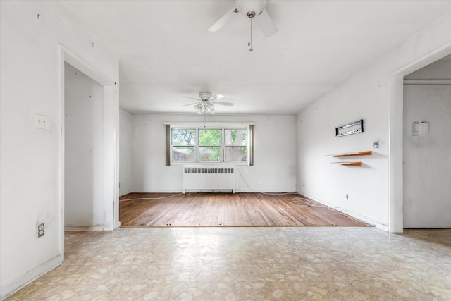 81-29 156th Ave Unit 4, Howard Beach, NY 11414 - unfurnished room with radiator heating unit, ceiling fan, and wood finished floors