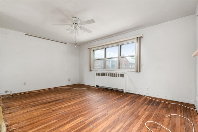 81-29 156th Ave Unit 4, Howard Beach, NY 11414 - unfurnished room with radiator, wood-type flooring, and a ceiling fan