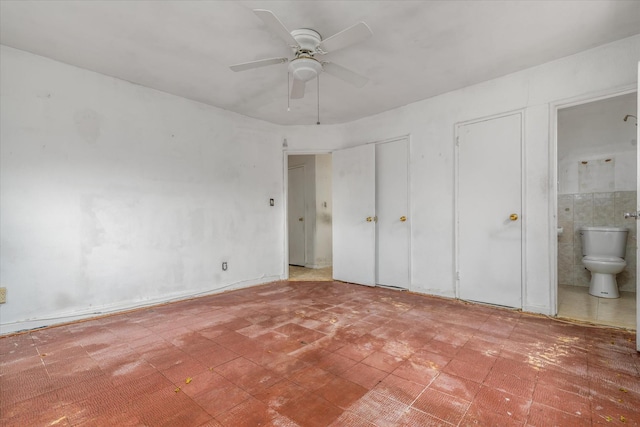 81-29 156th Ave Unit 4, Howard Beach, NY 11414 - unfurnished bedroom featuring tile patterned floors, ensuite bathroom, and ceiling fan