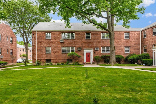 81-29 156th Ave Unit 4, Howard Beach, NY 11414 - view of front of house with a front yard and brick siding