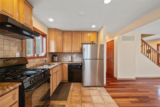 65 Netherwood Dr, Albertson, NY 11507 - kitchen with black appliances, range hood, tasteful backsplash, stone countertops, and recessed lighting