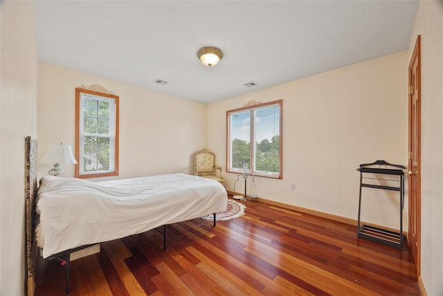 65 Netherwood Dr, Albertson, NY 11507 - bedroom featuring wood finished floors and baseboards