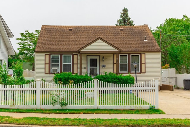 262 Park Ave, Babylon, NY 11702 - view of front of property with roof with shingles and a fenced front yard