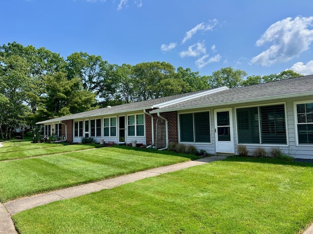 42D Trent Ct Unit 42D, Ridge, NY 11961 - ranch-style house featuring a front lawn, brick siding, and a shingled roof