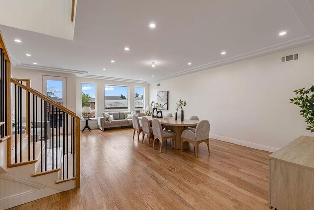 17 Union Rd Unit 208, Spring Valley, NY 10977 - dining room with light wood-type flooring, stairs, recessed lighting, and ornamental molding