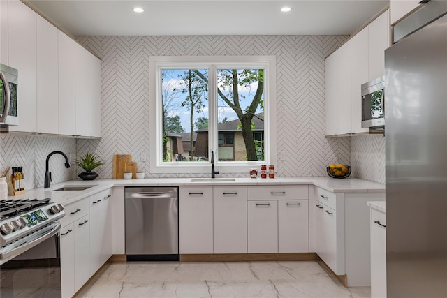 17 Union Rd Unit 208, Spring Valley, NY 10977 - kitchen with stainless steel appliances, light marble finish floors, recessed lighting, and backsplash