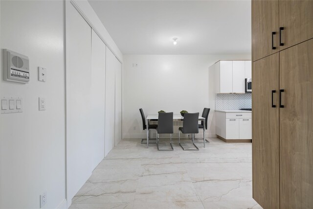 17 Union Rd Unit 208, Spring Valley, NY 10977 - dining space with light marble finish floors and baseboards