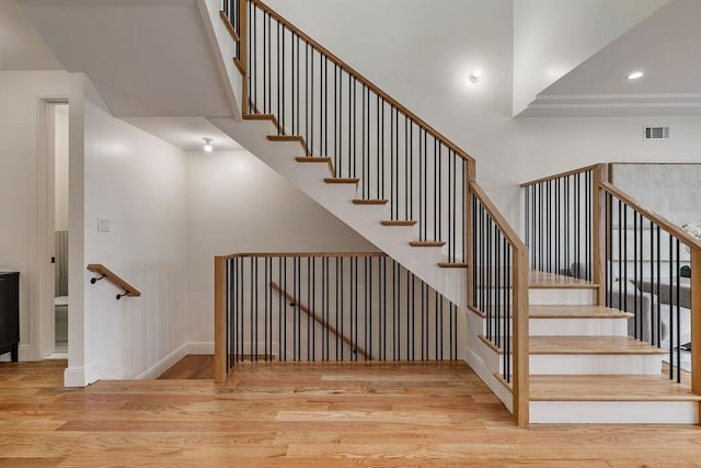 17 Union Rd Unit 208, Spring Valley, NY 10977 - staircase featuring wood finished floors, recessed lighting, and a towering ceiling