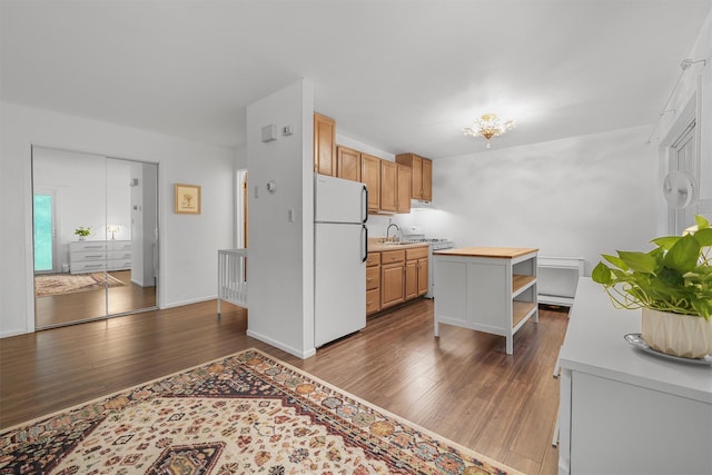 13 Scenic Dr Unit M, Croton-On-Hudson, NY 10520 - kitchen with white appliances, dark wood finished floors, open shelves, butcher block countertops, and a baseboard radiator