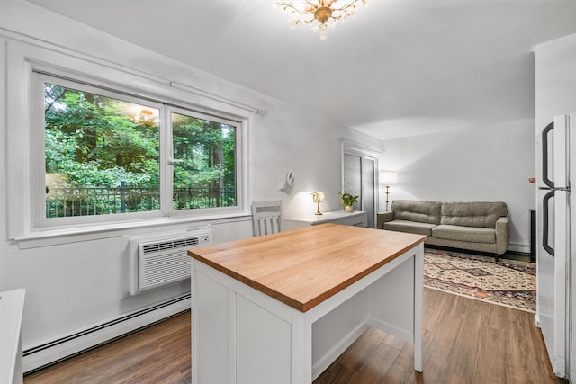13 Scenic Dr Unit M, Croton-On-Hudson, NY 10520 - kitchen featuring wooden counters, baseboard heating, freestanding refrigerator, dark wood-type flooring, and white cabinetry