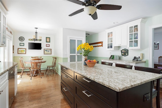 4 Tower Rd, Hopewell Junction, NY 12533 - kitchen with white cabinetry, ceiling fan, glass insert cabinets, stainless steel dishwasher, and light wood finished floors