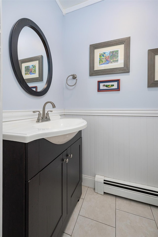 4 Tower Rd, Hopewell Junction, NY 12533 - bathroom featuring vanity, a baseboard radiator, tile patterned flooring, and a wainscoted wall