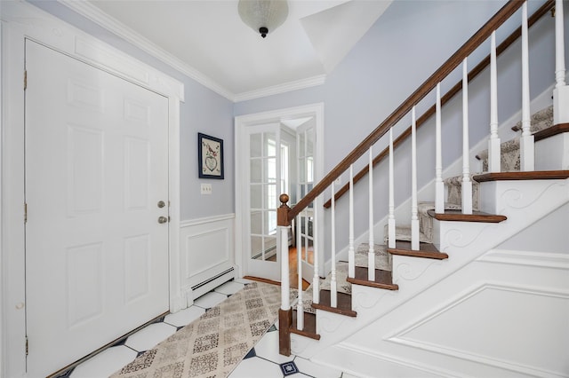 4 Tower Rd, Hopewell Junction, NY 12533 - entrance foyer featuring ornamental molding, stairway, baseboard heating, and a wainscoted wall
