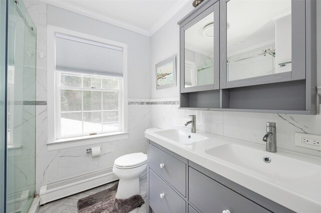 4 Tower Rd, Hopewell Junction, NY 12533 - bathroom featuring a baseboard heating unit, ornamental molding, tile walls, double vanity, and a marble finish shower