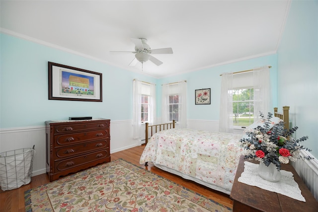 4 Tower Rd, Hopewell Junction, NY 12533 - bedroom featuring ornamental molding, wood finished floors, wainscoting, a ceiling fan, and a baseboard radiator
