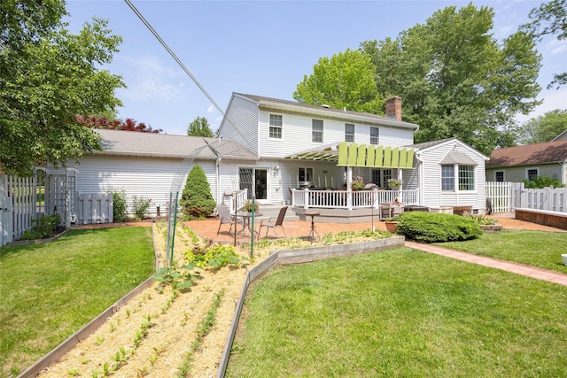 4 Tower Rd, Hopewell Junction, NY 12533 - back of house featuring a vegetable garden, a chimney, and a deck