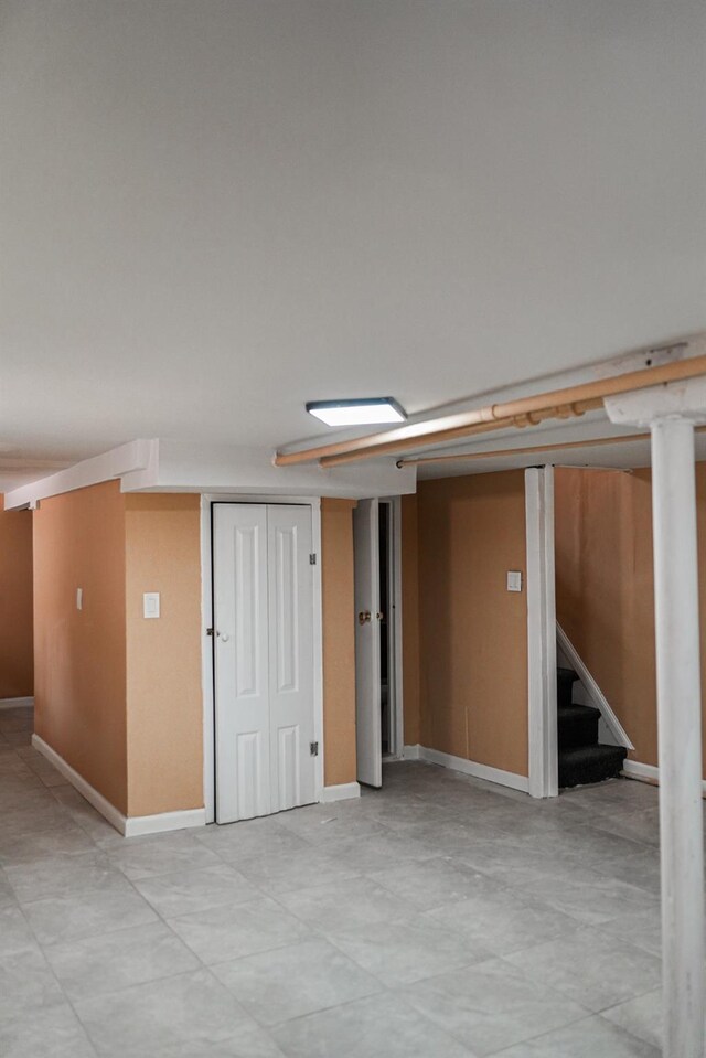 8620 130th St, Richmond Hill, NY 11418 - spare room with stairway and baseboards