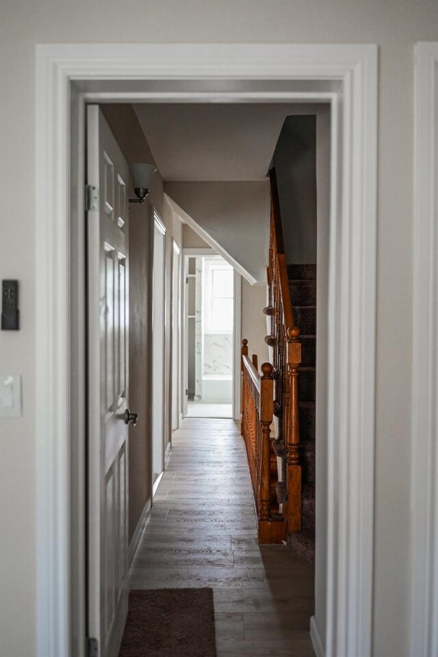 8620 130th St, Richmond Hill, NY 11418 - corridor featuring wood finished floors and stairs