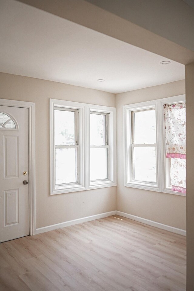 8620 130th St, Richmond Hill, NY 11418 - foyer entrance featuring light wood-style flooring and baseboards