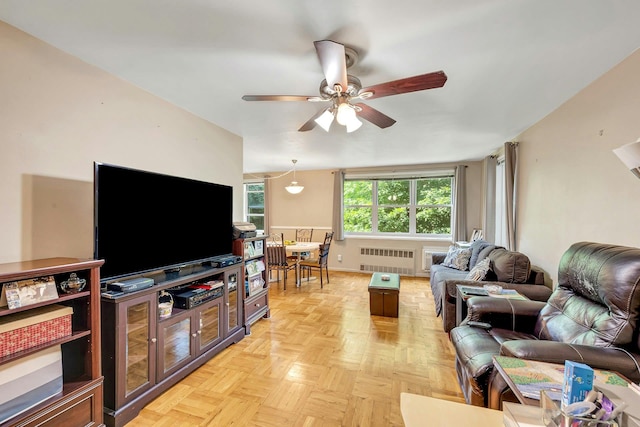 98 Dehaven Dr Unit 1F, Yonkers, NY 10703 - living area with radiator and ceiling fan