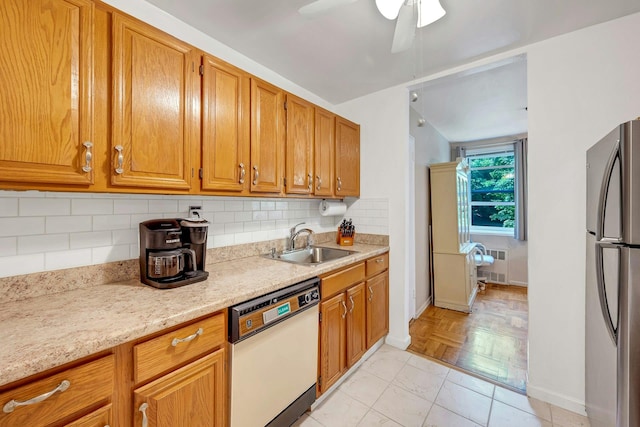 98 Dehaven Dr Unit 1F, Yonkers, NY 10703 - kitchen with dishwasher, freestanding refrigerator, backsplash, a ceiling fan, and brown cabinets