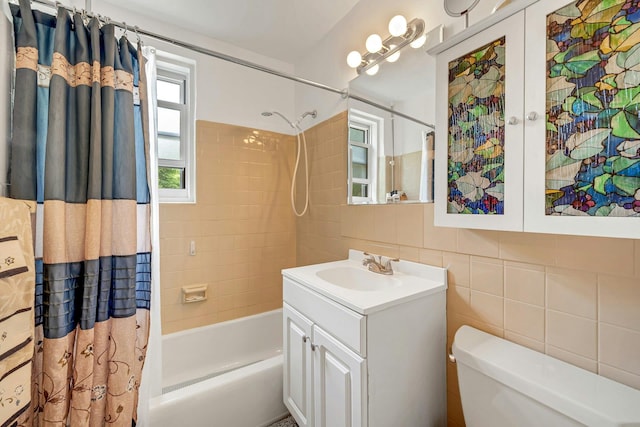 98 Dehaven Dr Unit 1F, Yonkers, NY 10703 - bathroom featuring shower / tub combo with curtain, vanity, and tile walls