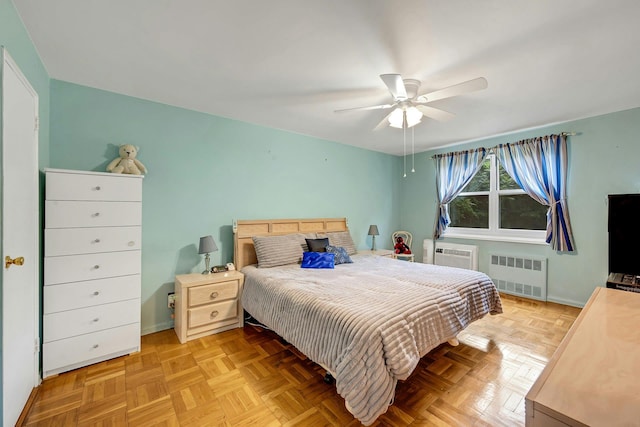 98 Dehaven Dr Unit 1F, Yonkers, NY 10703 - bedroom with radiator heating unit, a ceiling fan, and a wall mounted AC