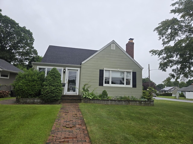 1206 August Rd, North Babylon, NY 11703 - view of front of home with a front yard, a chimney, and entry steps