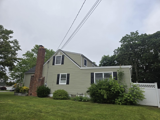 1206 August Rd, North Babylon, NY 11703 - view of side of property with a chimney
