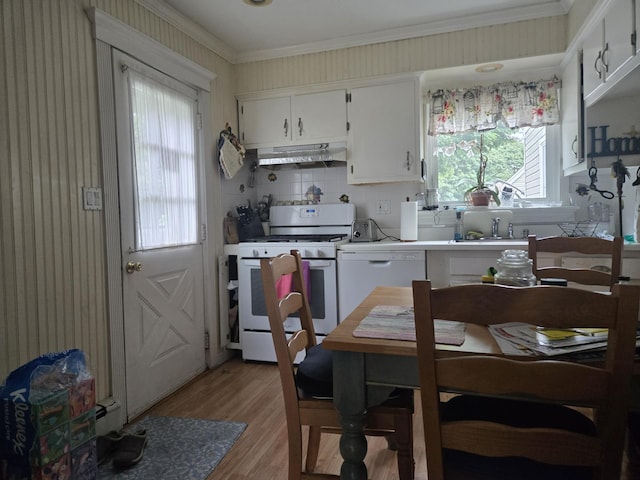 1206 August Rd, North Babylon, NY 11703 - kitchen featuring white appliances, under cabinet range hood, light wood-style floors, ornamental molding, and white cabinets