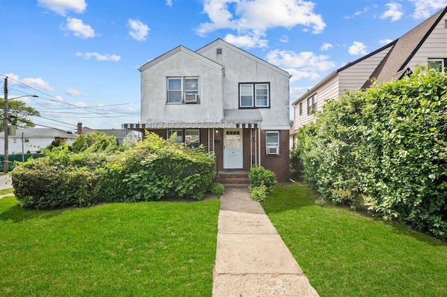 94 Shaw Ave, Valley Stream, NY 11580 - view of front of property featuring a front yard and brick siding