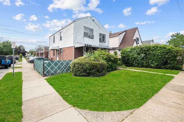 94 Shaw Ave, Valley Stream, NY 11580 - view of side of home with a yard and brick siding
